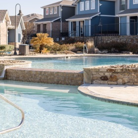 Resort-style pool with lounging area